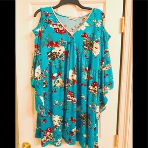 Never worn, has cut out shoulders. Too Big :(